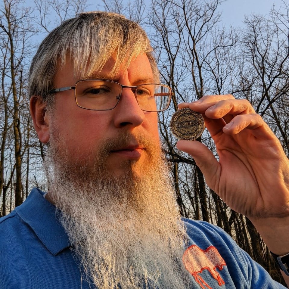 Billy holding his Ragnarök coin he won through the VIKINGS vs SAMURAI coin giveaway contest